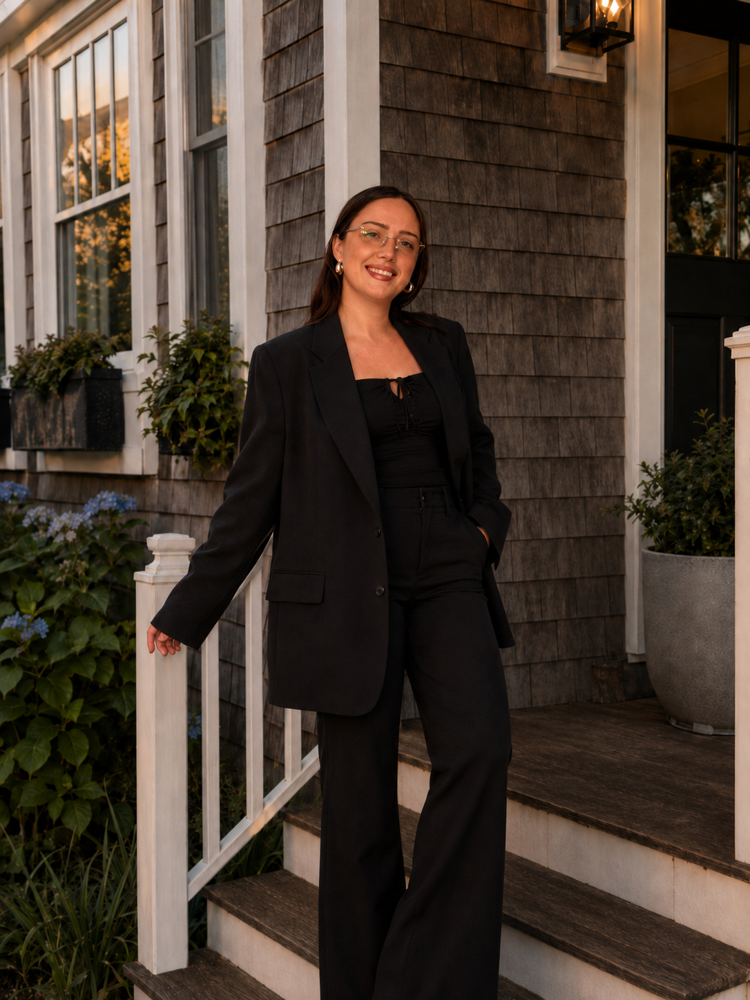 Allison Webber, owner of Weaver's Passage Estate Sales, on a front porch
